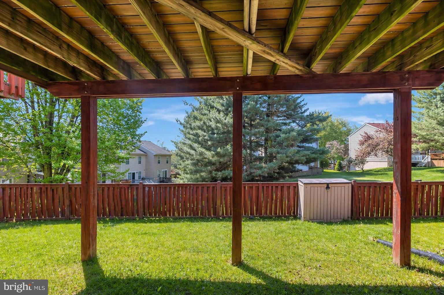 10983 Baskerville Road Reisterstown, MD 21136 - Photo 18 of 21 a view of a backyard with wooden fence and floor