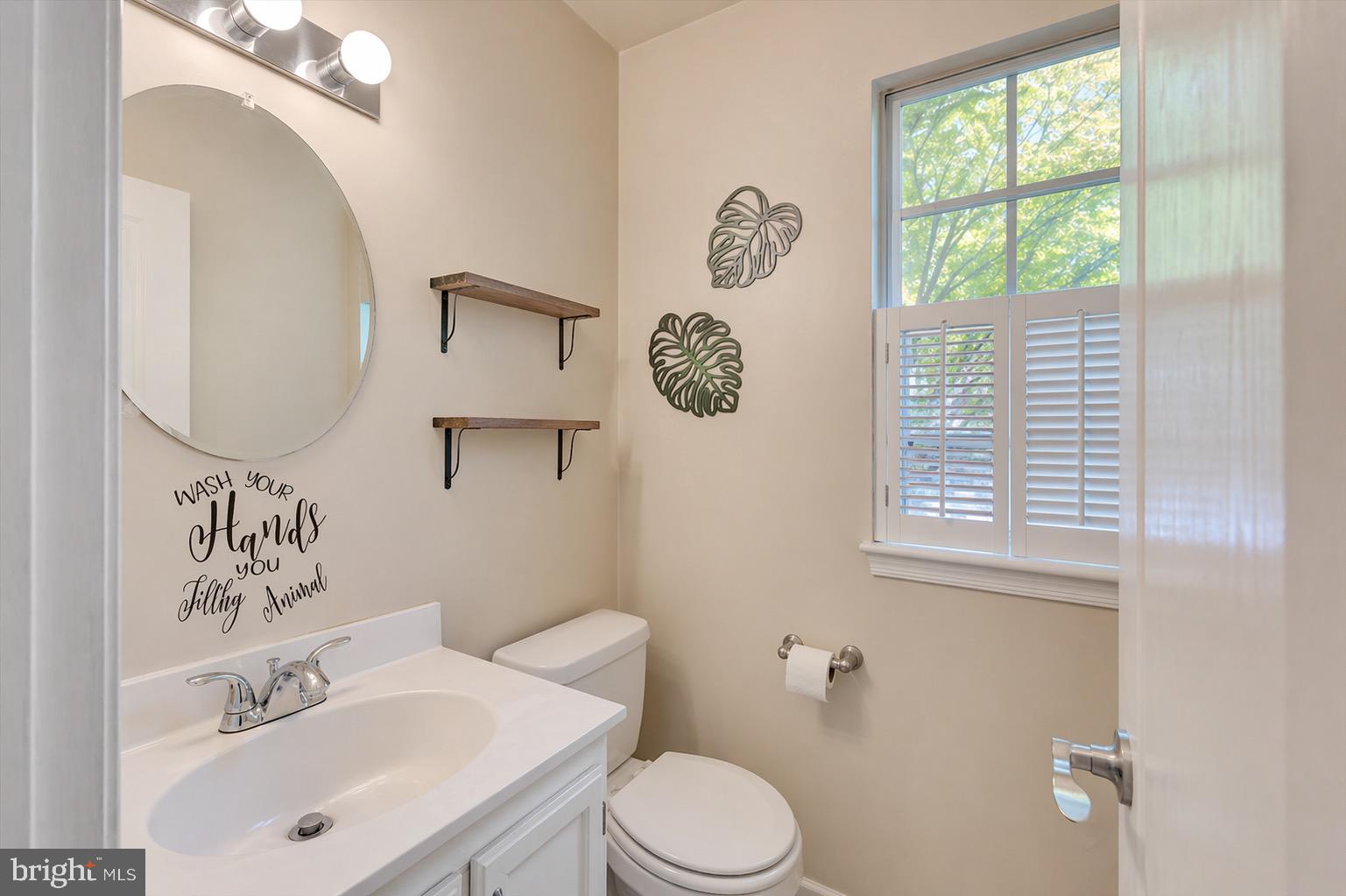 10983 Baskerville Road Reisterstown, MD 21136 - Photo 5 of 21 a bathroom with a toilet sink and mirror