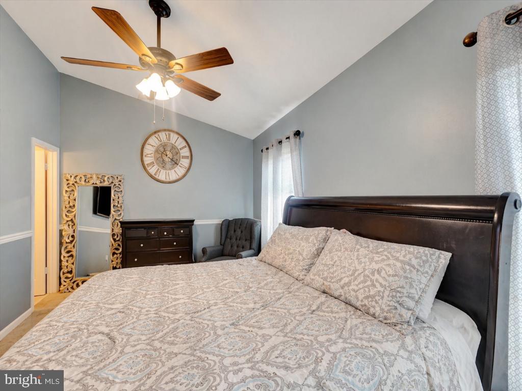 10983 Baskerville Road Reisterstown, MD 21136 - Photo 8 of 21 a bedroom with a bed and a ceiling fan