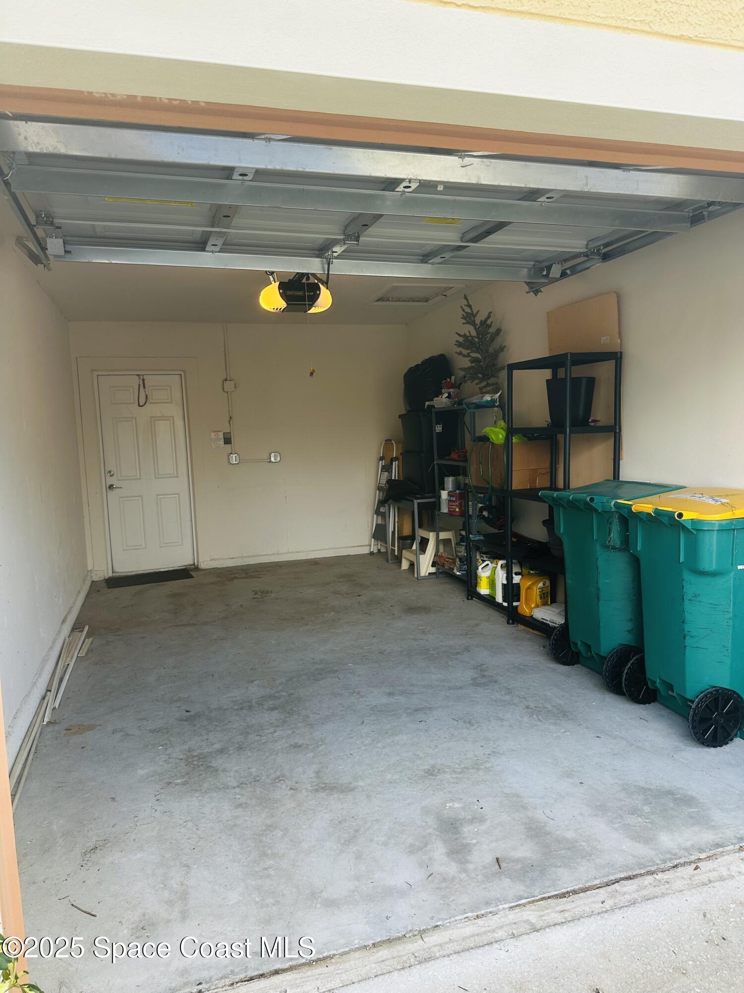 890 Luminary Circle, Unit 103 Melbourne, FL 32901 - Photo 13 of 13 a view of garage