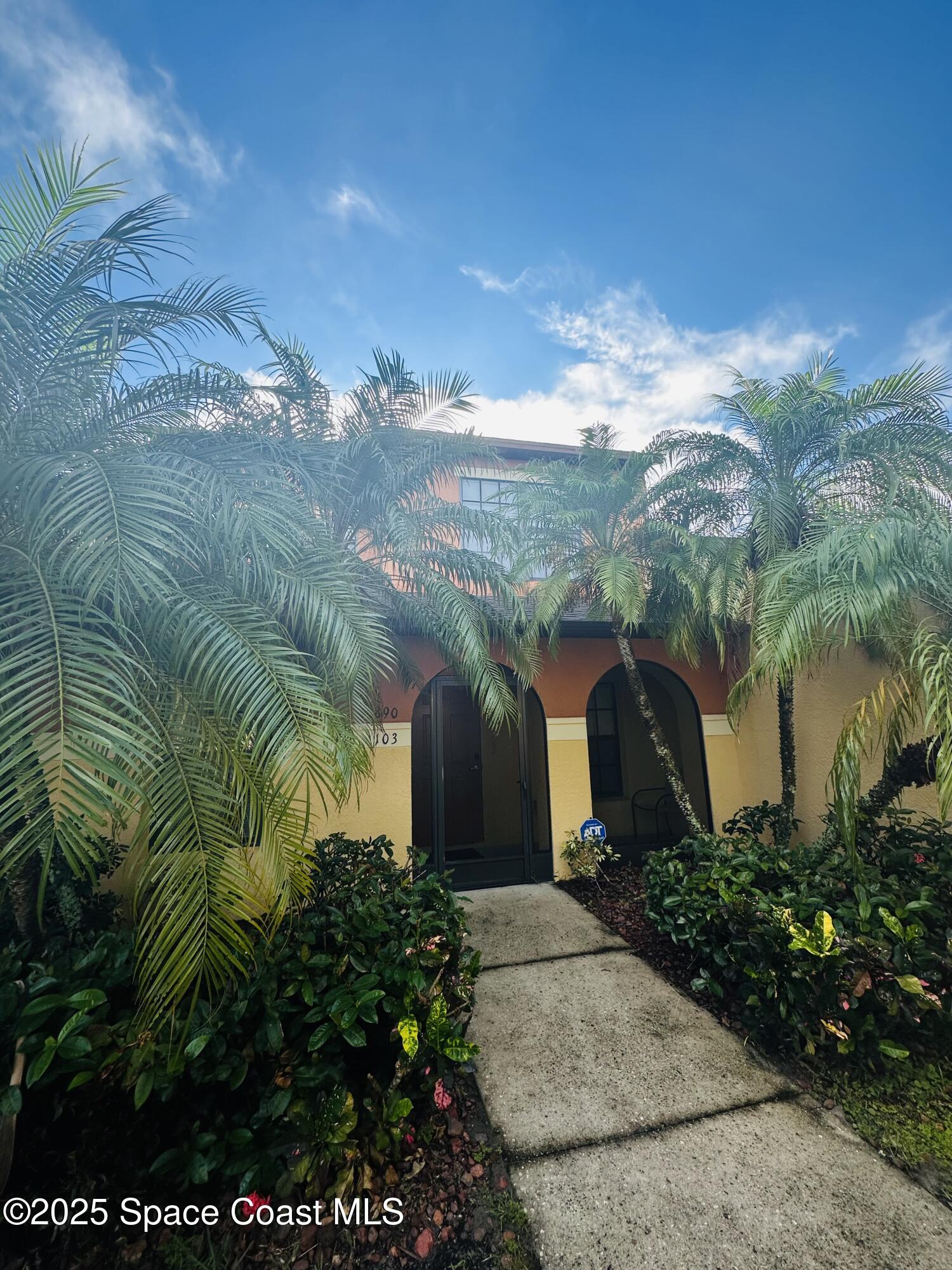 890 Luminary Circle, Unit 103 Melbourne, FL 32901 - Photo 2 of 13 a view of a garden