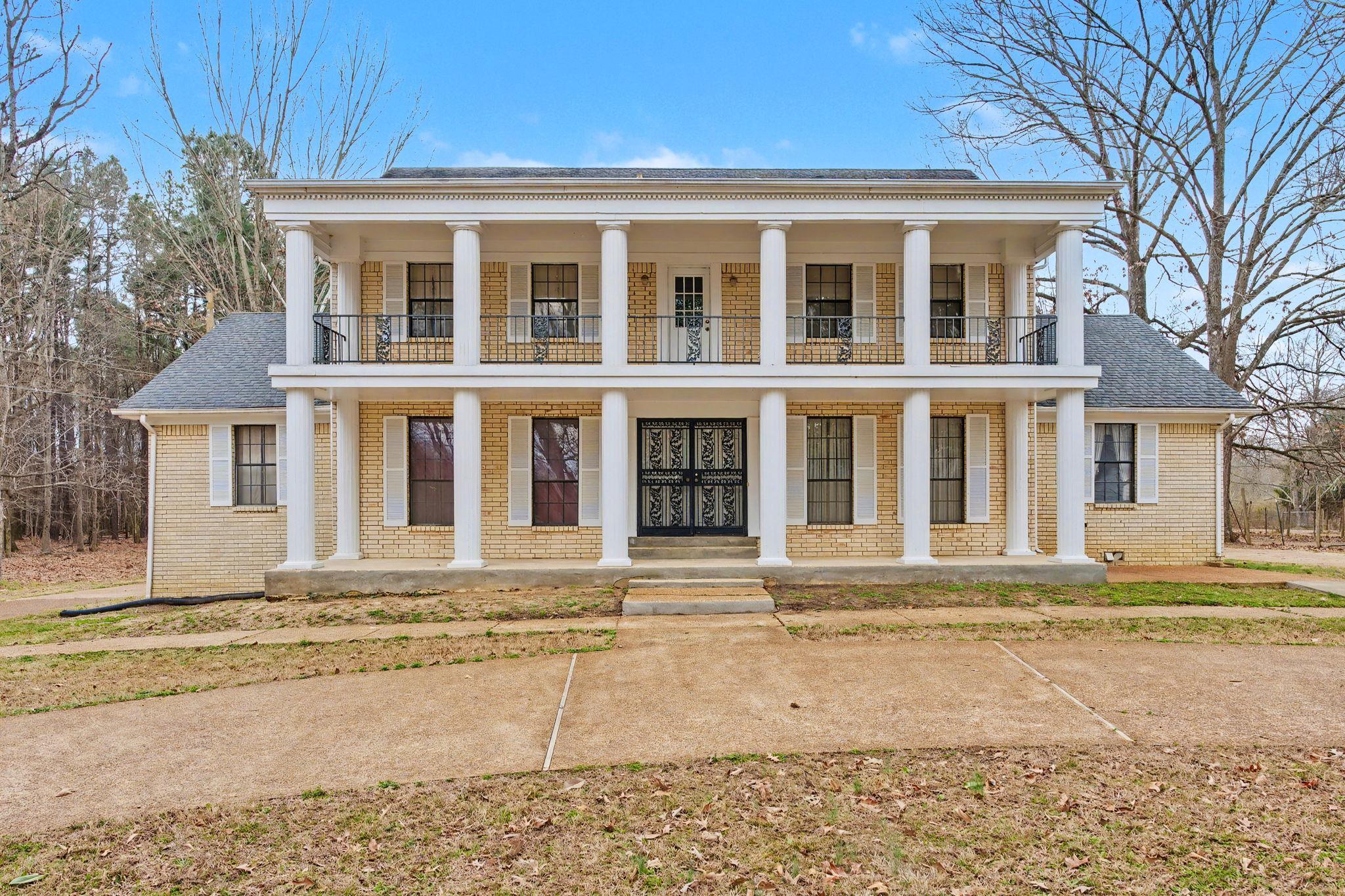 7439 Lexie Gardner Road Bartlett, TN 38002 - Photo 1 of 40 a front view of a house