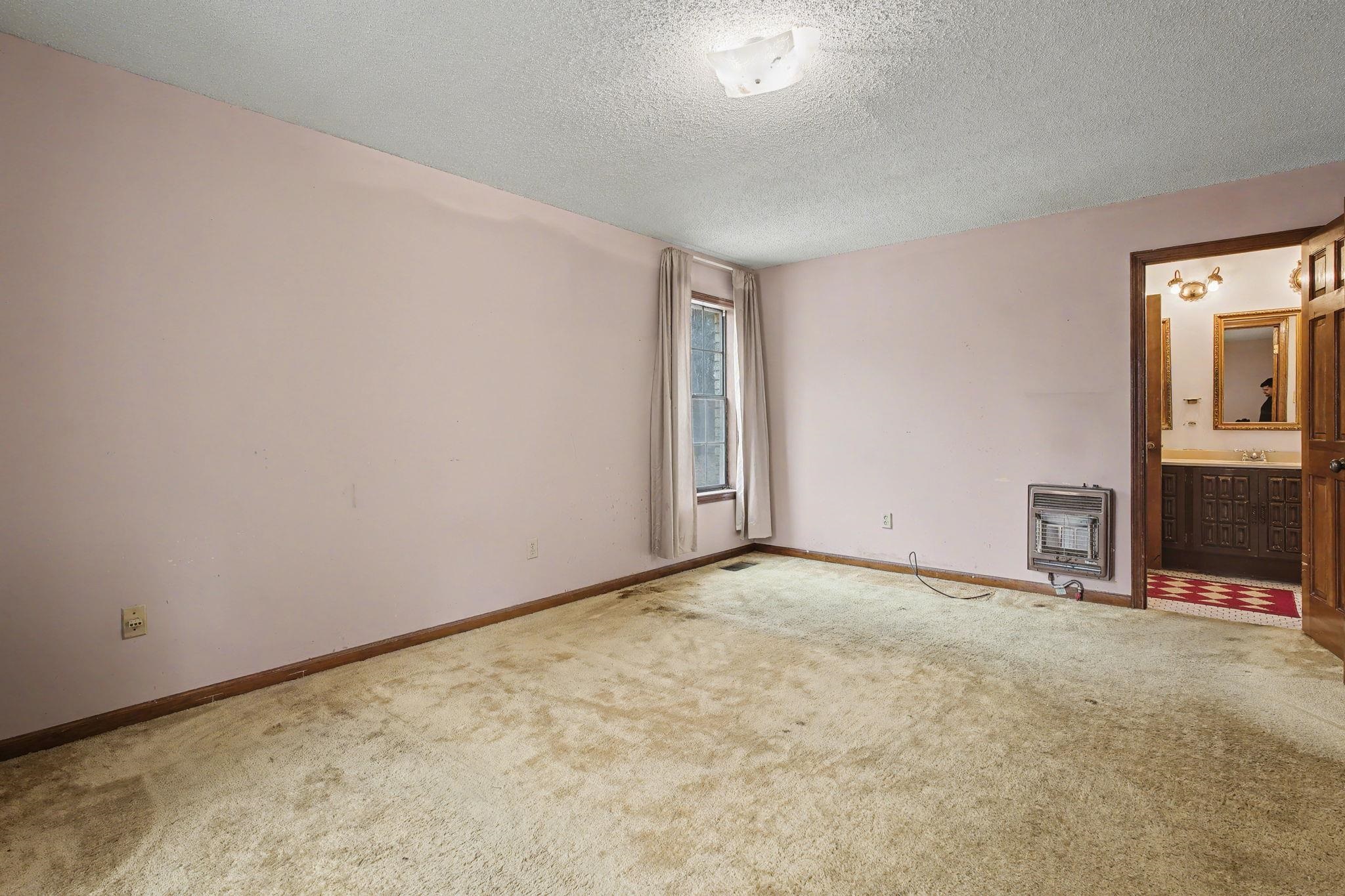 7439 Lexie Gardner Road Bartlett, TN 38002 - Photo 15 of 40 an empty room with floor to ceiling window