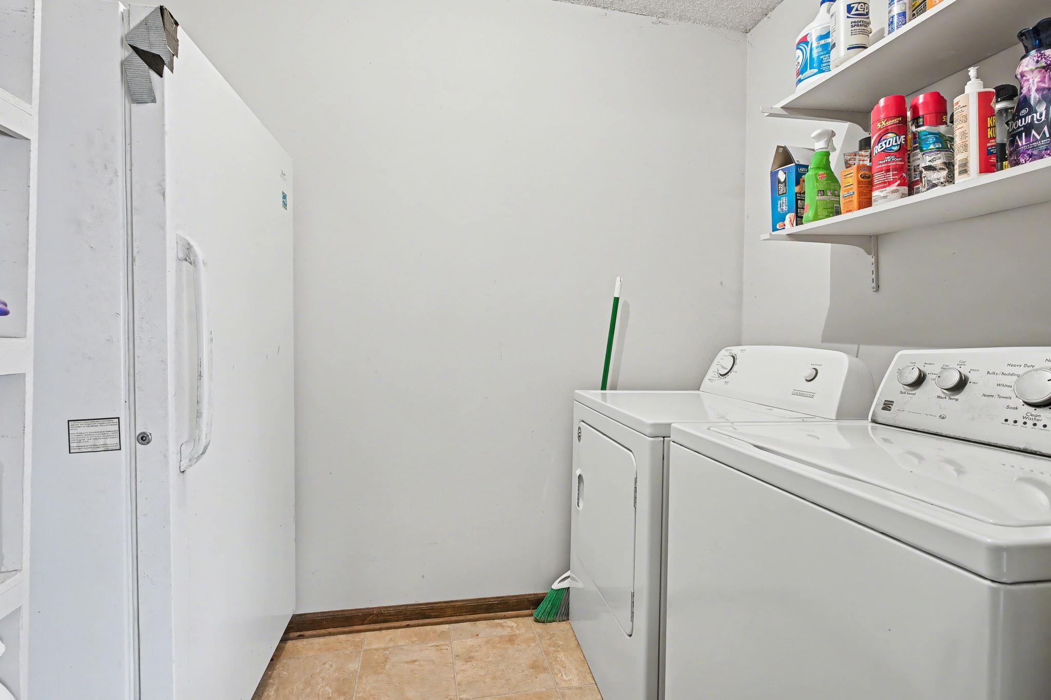 7439 Lexie Gardner Road Bartlett, TN 38002 - Photo 22 of 40 a utility room with dryer and washer
