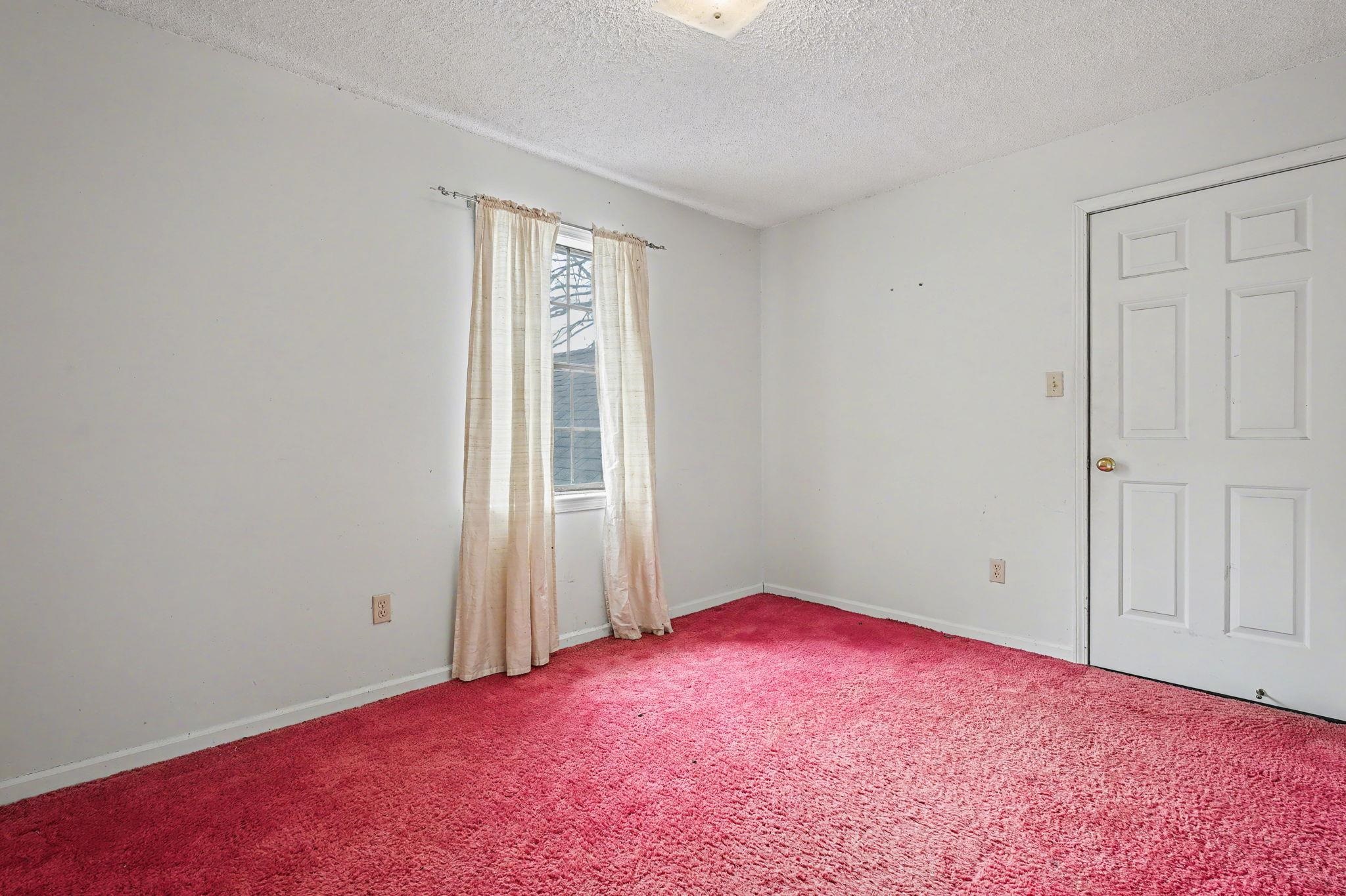 7439 Lexie Gardner Road Bartlett, TN 38002 - Photo 23 of 40 an empty room with a natural light