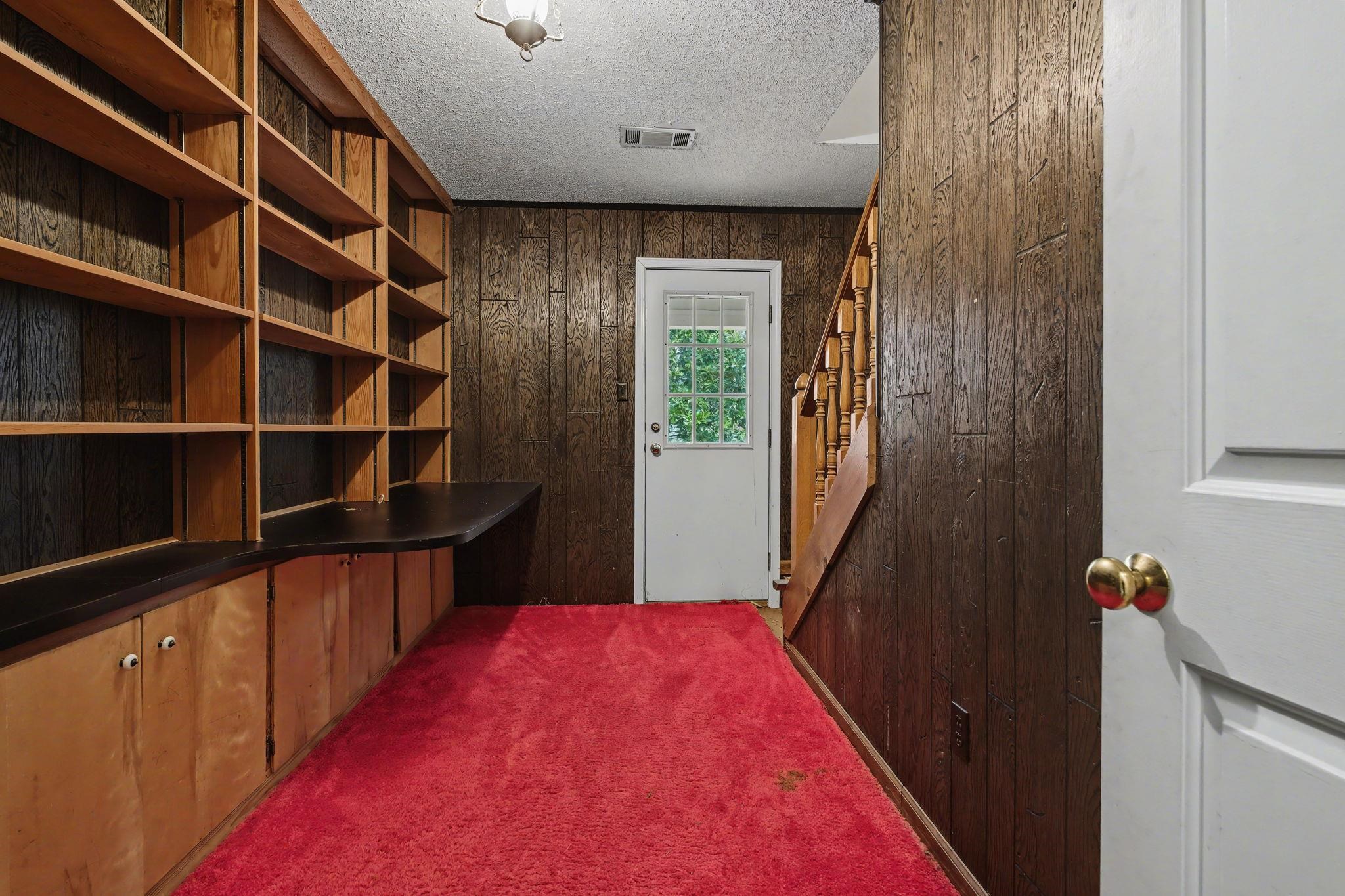 7439 Lexie Gardner Road Bartlett, TN 38002 - Photo 29 of 40 a hallway with cabinets and wooden floor