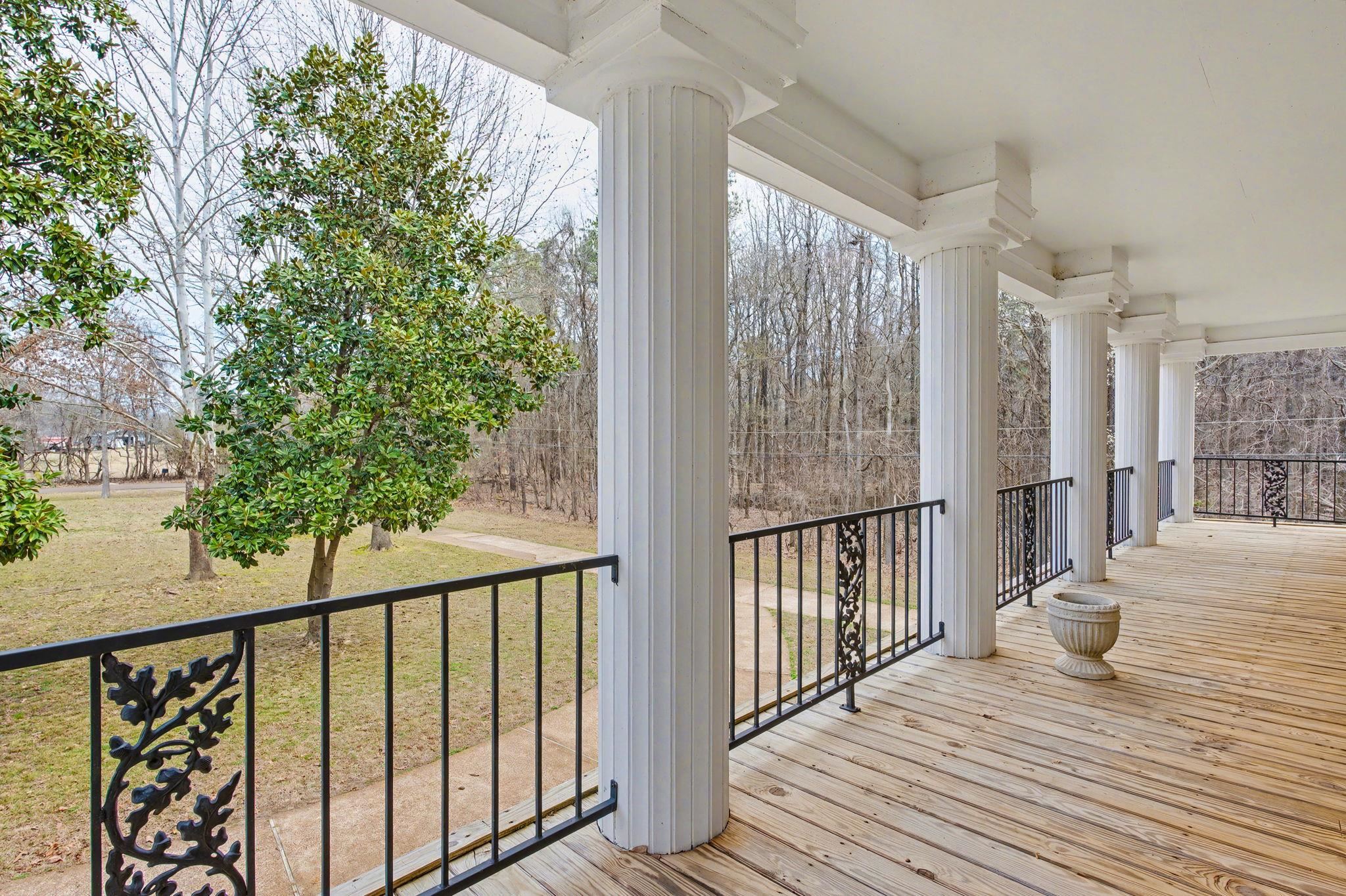 7439 Lexie Gardner Road Bartlett, TN 38002 - Photo 30 of 40 a view of a balcony with wooden floor