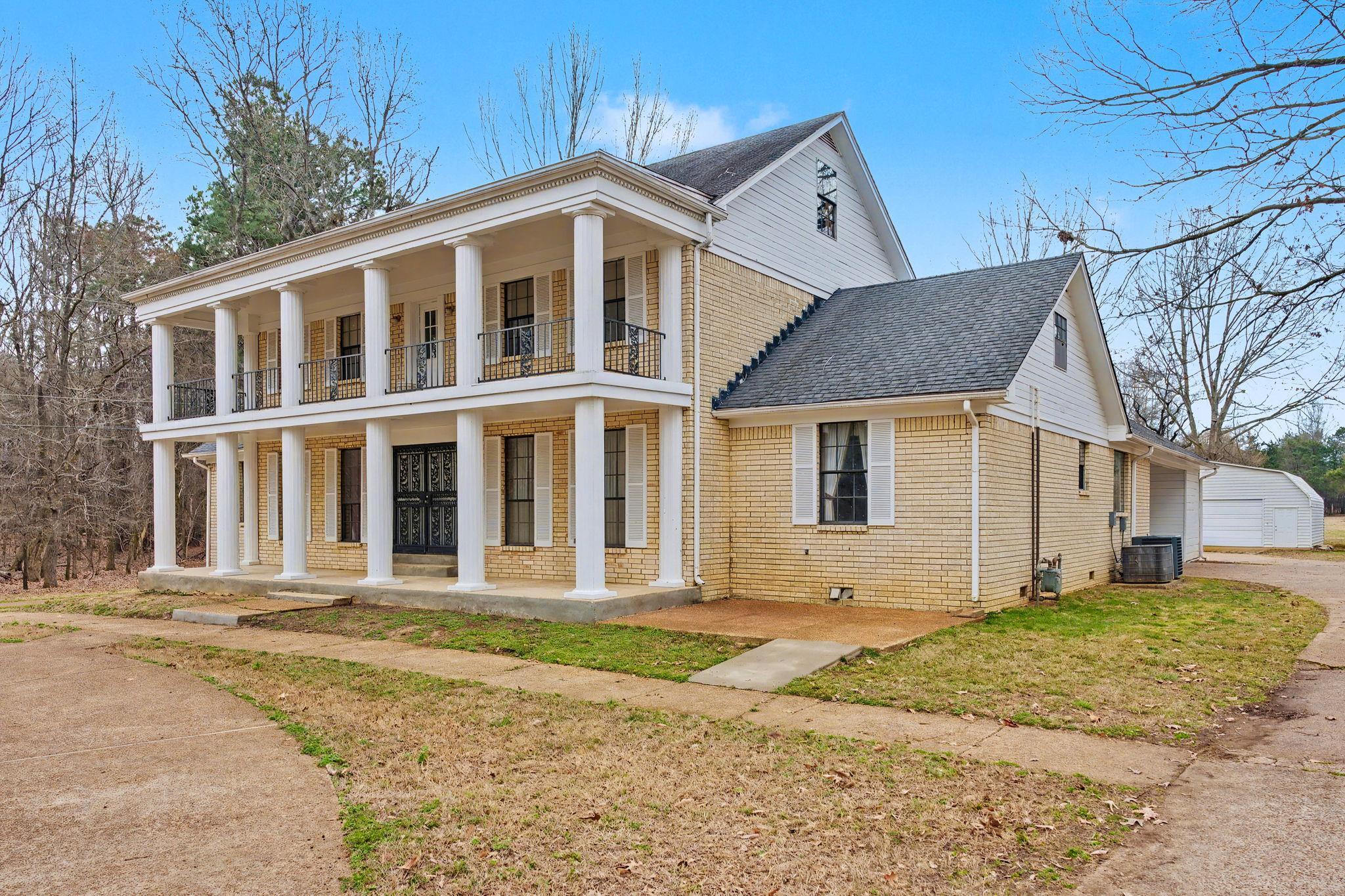 7439 Lexie Gardner Road Bartlett, TN 38002 - Photo 3 of 40 a front view of a house with a yard