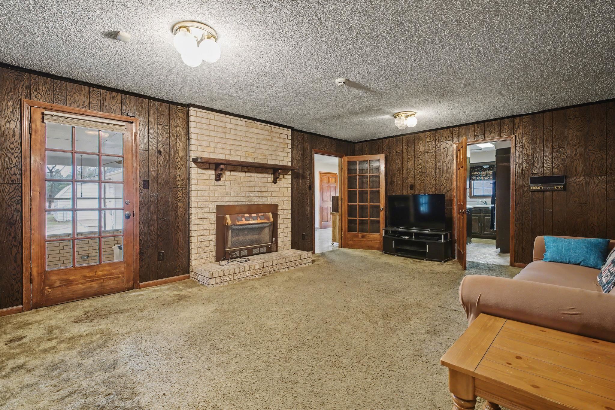 7439 Lexie Gardner Road Bartlett, TN 38002 - Photo 6 of 40 an empty room with furniture and a fireplace