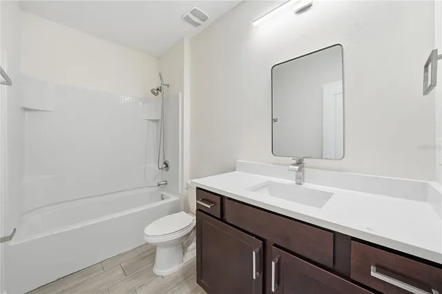 a bathroom with a sink a toilet and a bathtub
