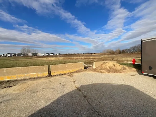 a view of car parked on the side of the road