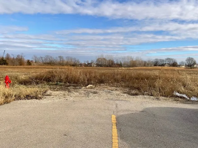 a view of street with parked cars