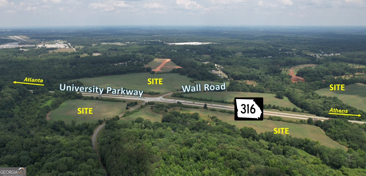 0 Highway 316 & Wall Road Statham, GA 30666 - Photo 3 of 8 a view of a sign board with a lake