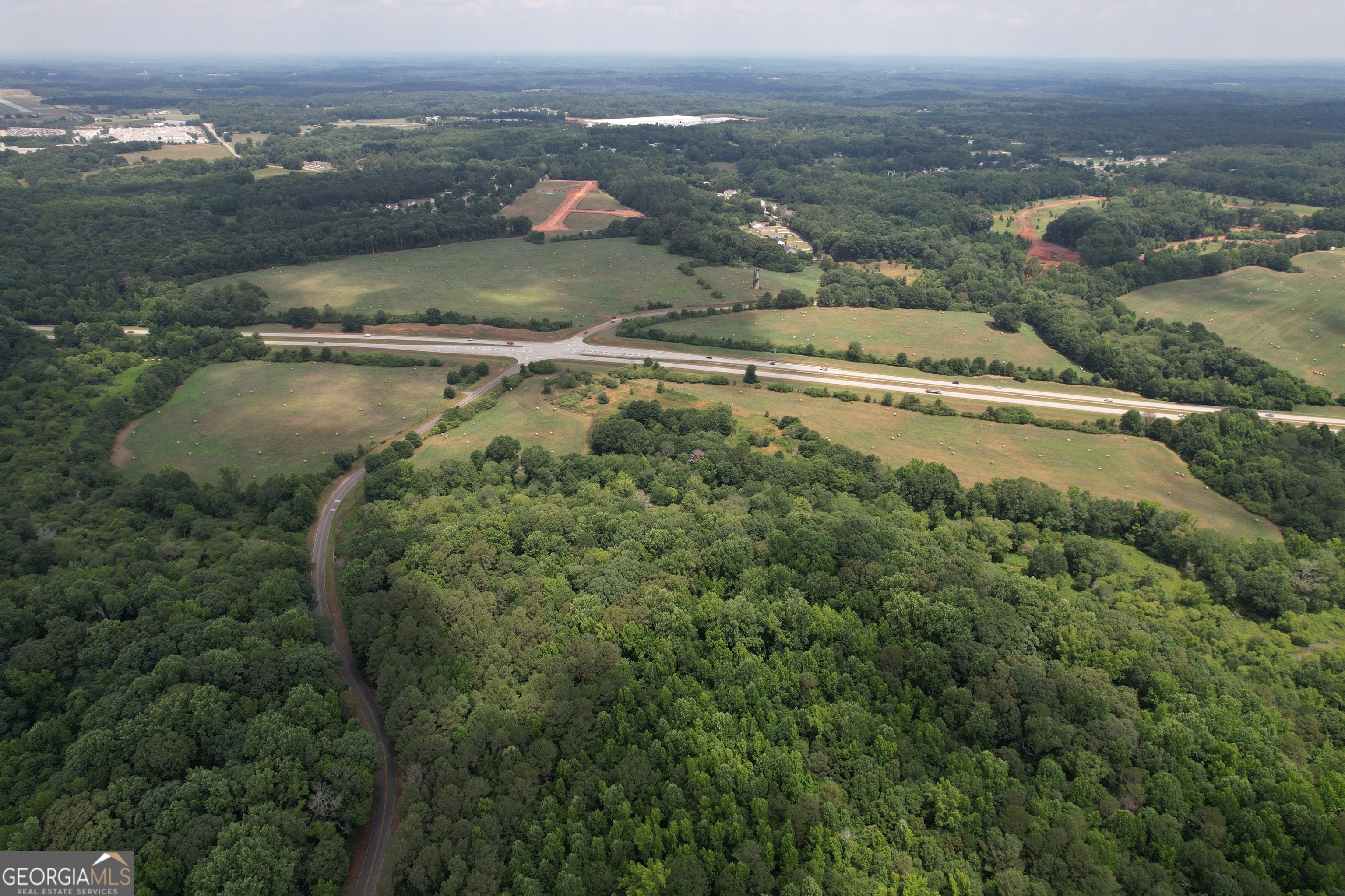 0 Highway 316 & Wall Road Statham, GA 30666 - Photo 7 of 8 an aerial view of residential houses with outdoor space and river