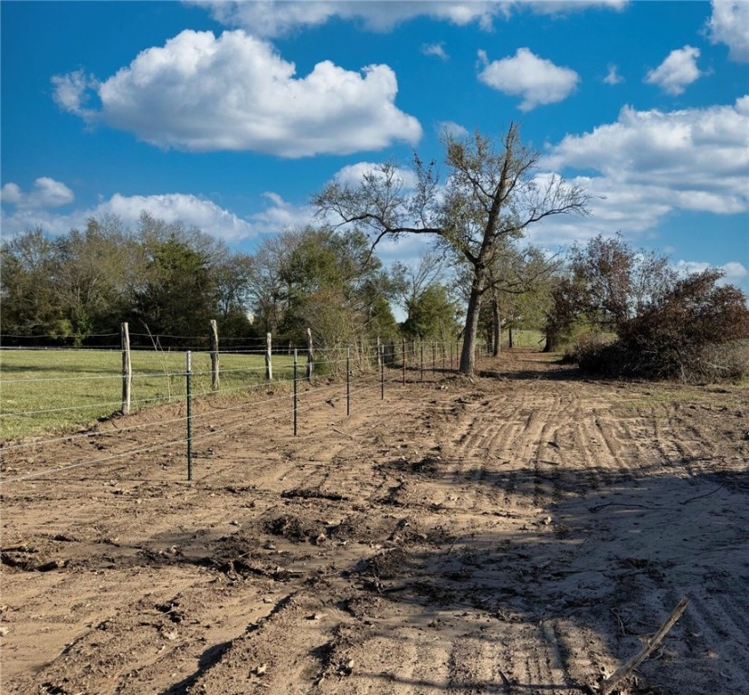 11281 Gourd Neck Loop, Unit COUNTYROAD Franklin, TX 77856 - Photo 12 of 46 a view of a yard with wooden fence