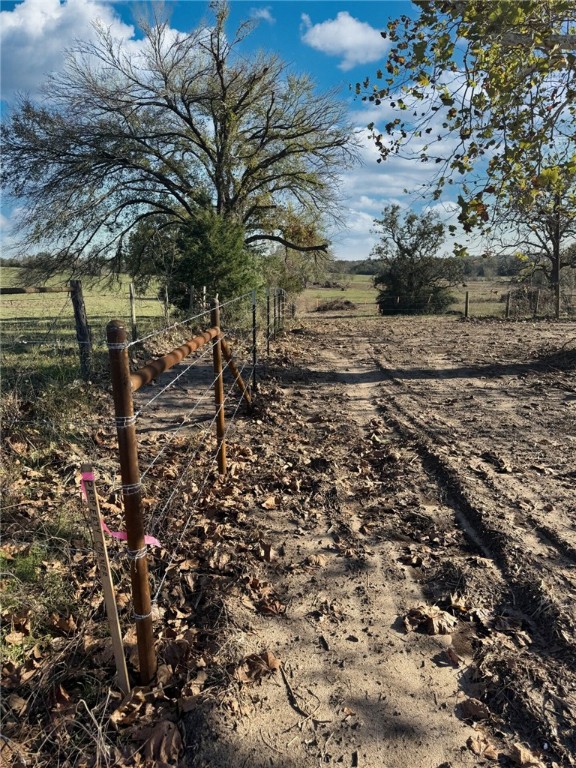 11281 Gourd Neck Loop, Unit COUNTYROAD Franklin, TX 77856 - Photo 16 of 46 a view of a yard with wooden fence