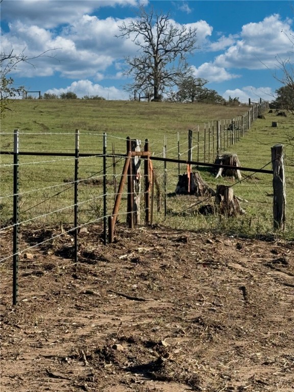 11281 Gourd Neck Loop, Unit COUNTYROAD Franklin, TX 77856 - Photo 17 of 46 a view of a lake with a table and chairs