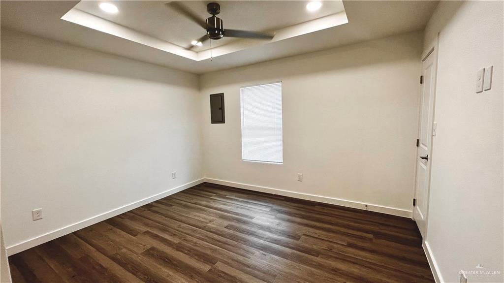 4005 Jenna Lane, Unit A Weslaco, TX 78599 - Photo 13 of 28 a view of room with window and wooden floor