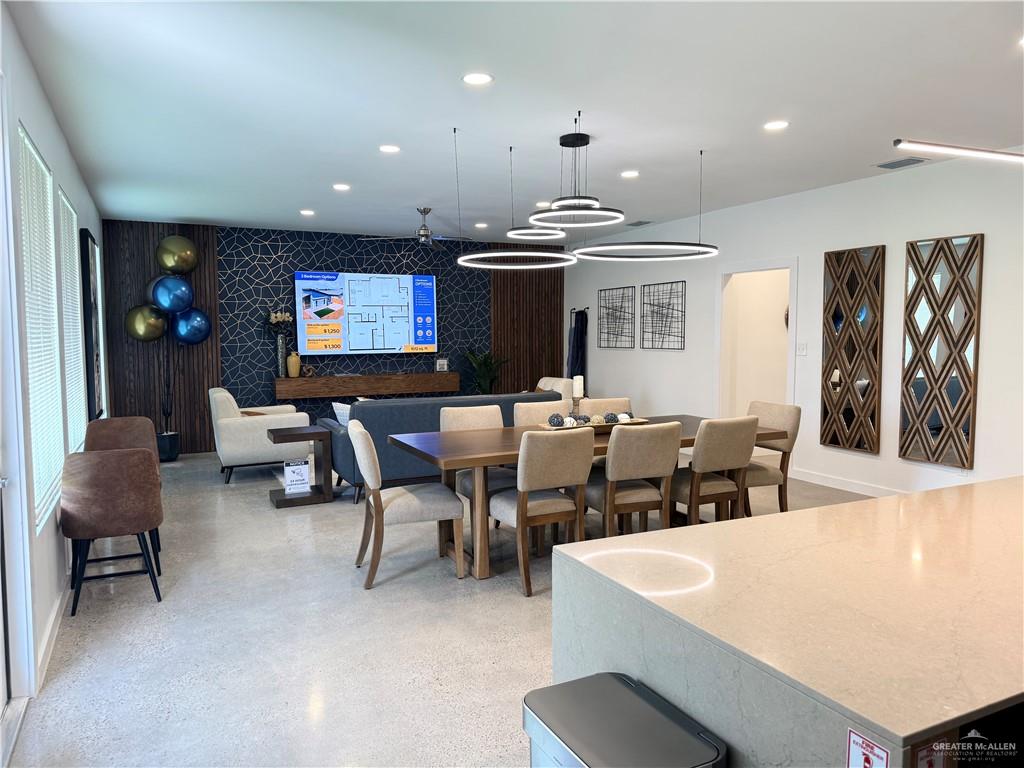 4005 Jenna Lane, Unit A Weslaco, TX 78599 - Photo 18 of 28 a dinning room with furniture a rug and white walls