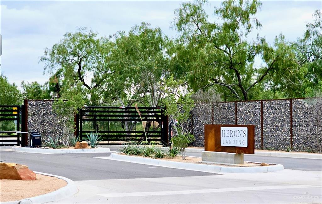 4005 Jenna Lane, Unit A Weslaco, TX 78599 - Photo 5 of 28 a sign that is sitting on the side of a road