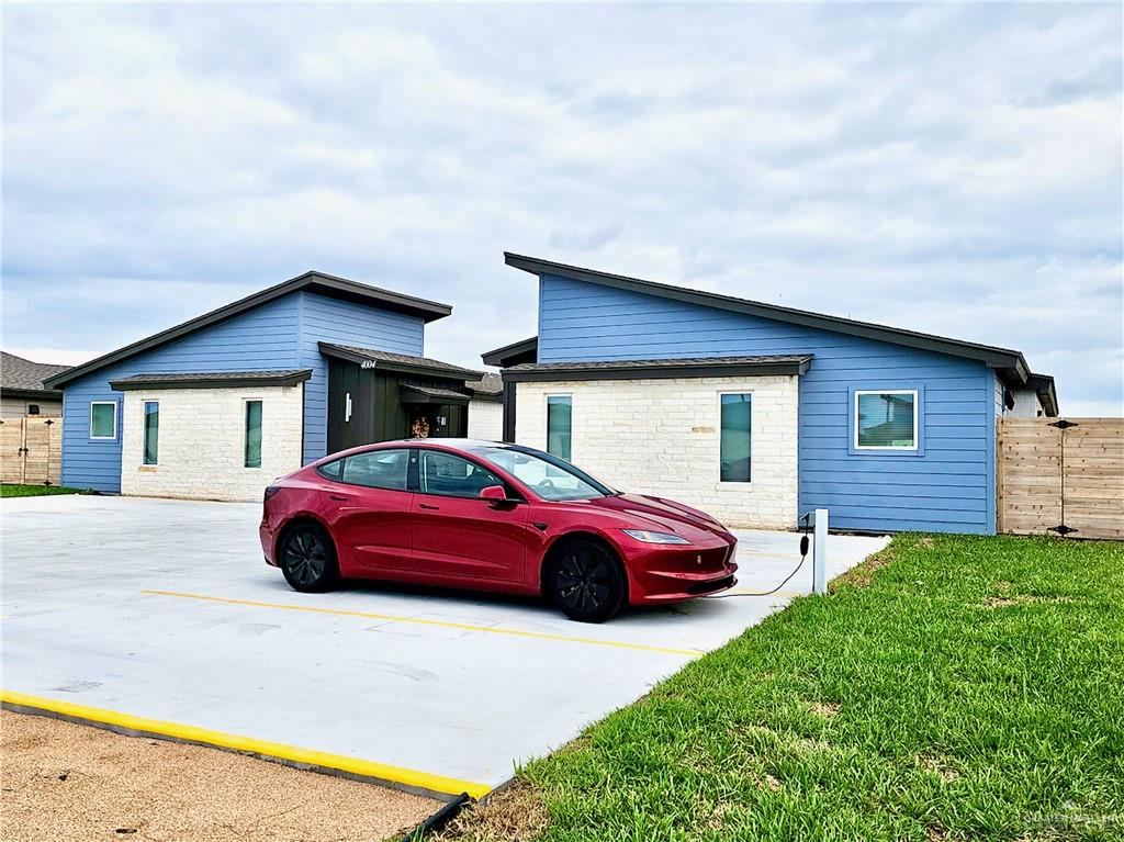4005 Jenna Lane, Unit A Weslaco, TX 78599 - Photo 7 of 28 a front view of a house with parking space