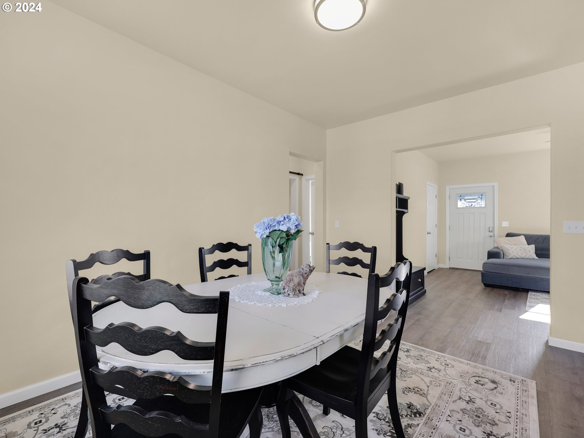 118 Main Street Southwest Ilwaco, WA 98624 - Photo 12 of 44 a view of a dining room with furniture and a rug