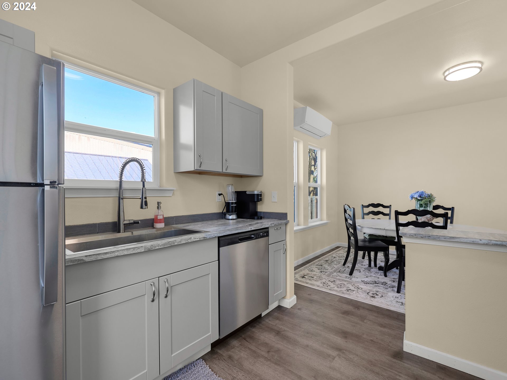 118 Main Street Southwest Ilwaco, WA 98624 - Photo 14 of 44 a kitchen with a sink cabinets and wooden floor