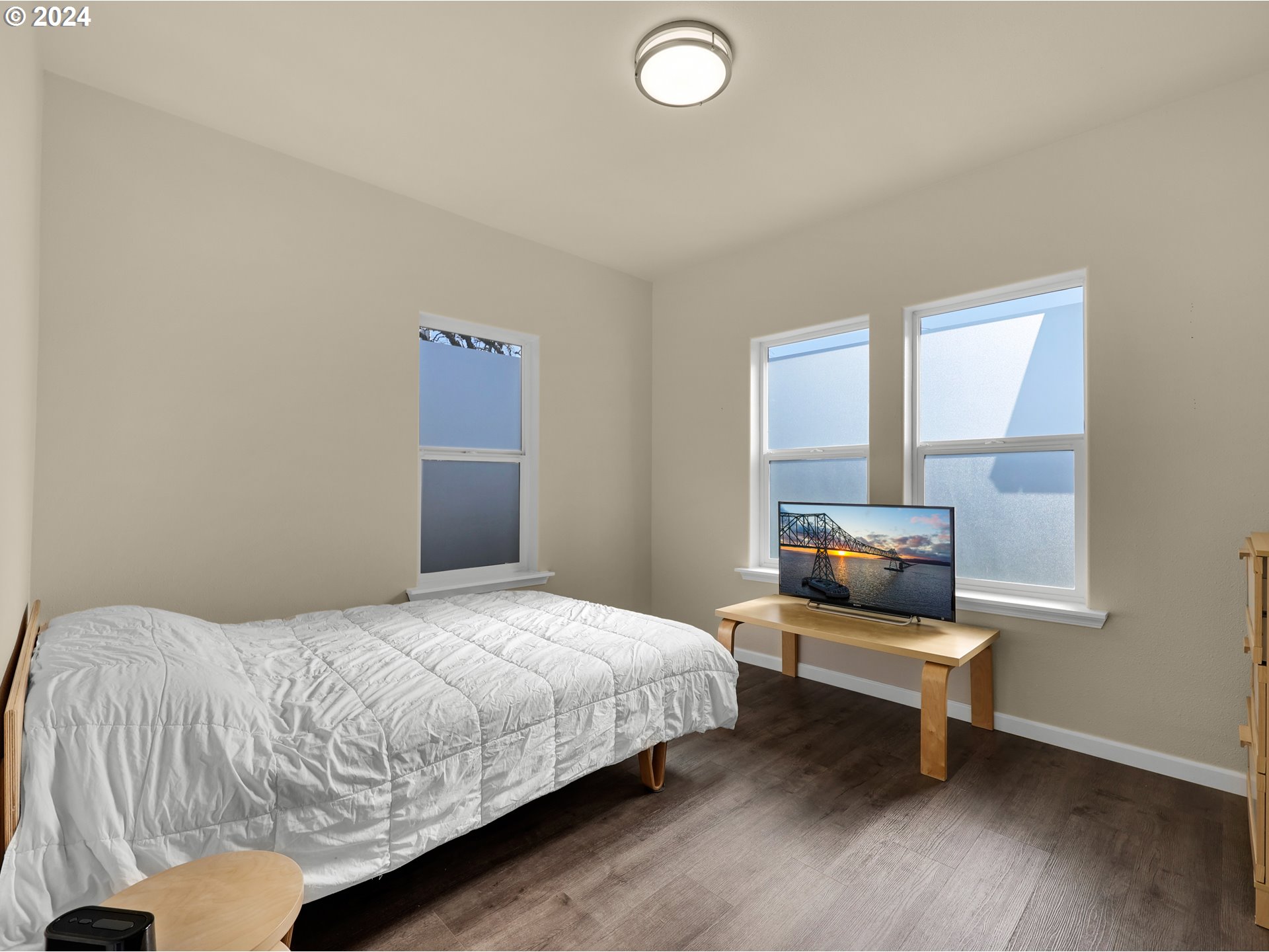 118 Main Street Southwest Ilwaco, WA 98624 - Photo 22 of 44 a bedroom with a bed and a window