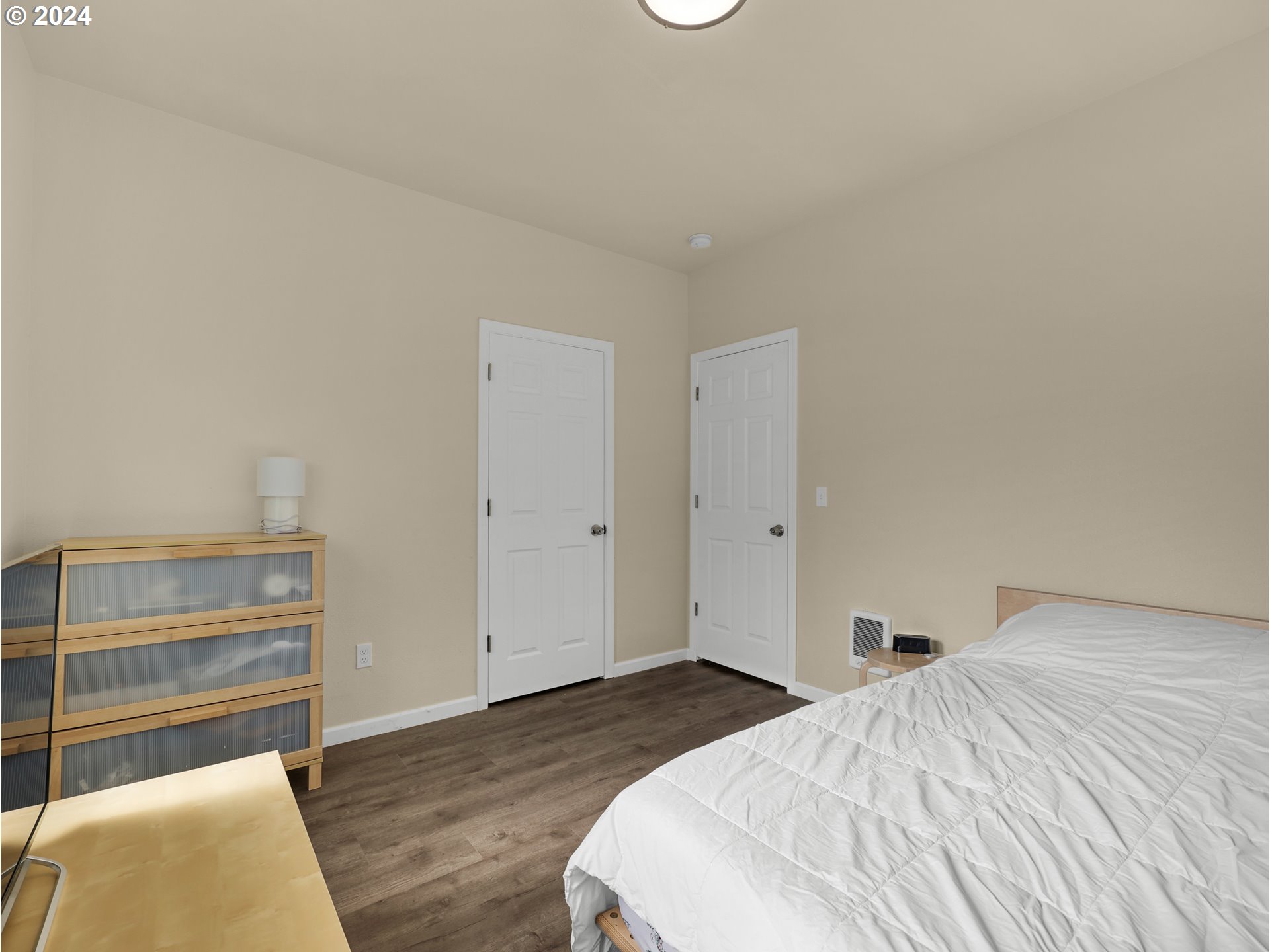 118 Main Street Southwest Ilwaco, WA 98624 - Photo 24 of 44 a bedroom with a bed and a couch
