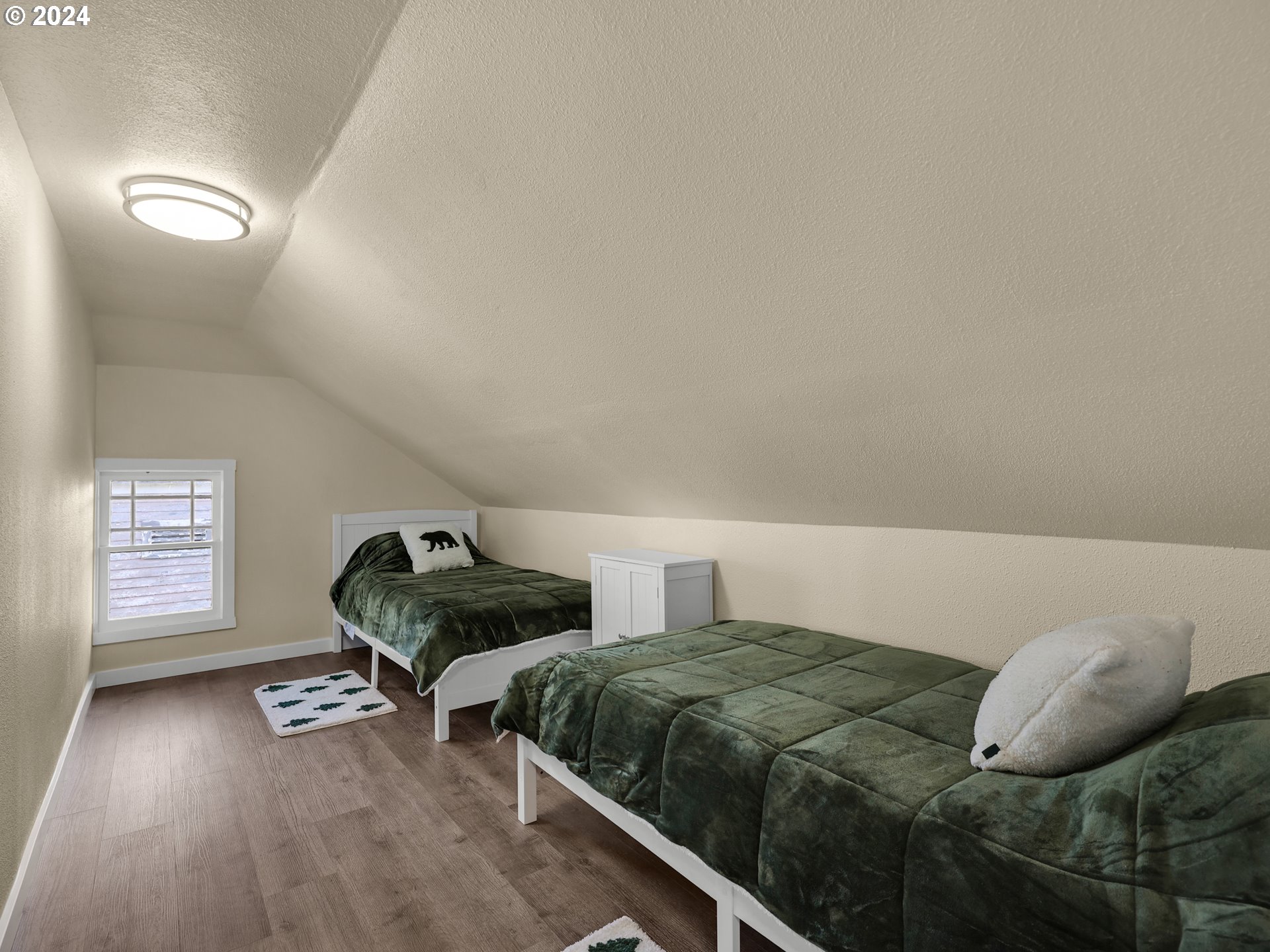 118 Main Street Southwest Ilwaco, WA 98624 - Photo 31 of 44 a bedroom with two beds and a window