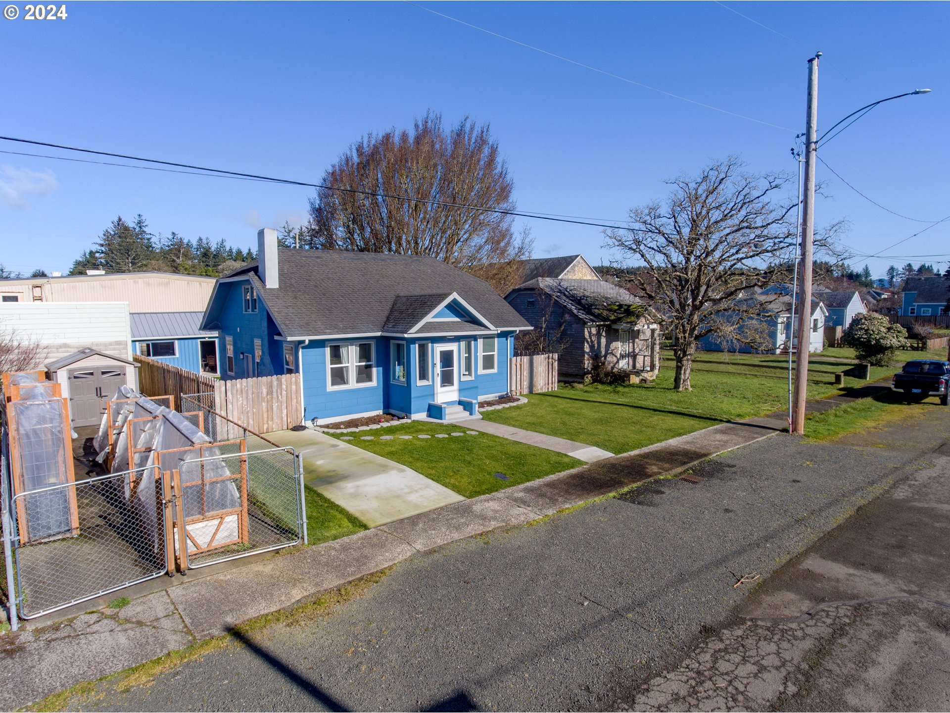 118 Main Street Southwest Ilwaco, WA 98624 - Photo 43 of 44 a view of a house with cars parked on the road