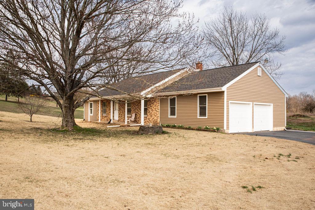 245 Windy Hill Road Shermans Dale, PA 17090 - Photo 1 of 42 a front view of a house with a yard