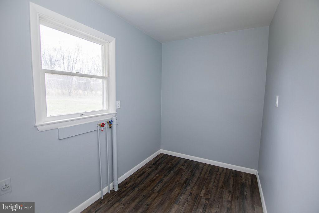 245 Windy Hill Road Shermans Dale, PA 17090 - Photo 27 of 42 an empty room with wooden floor and windows
