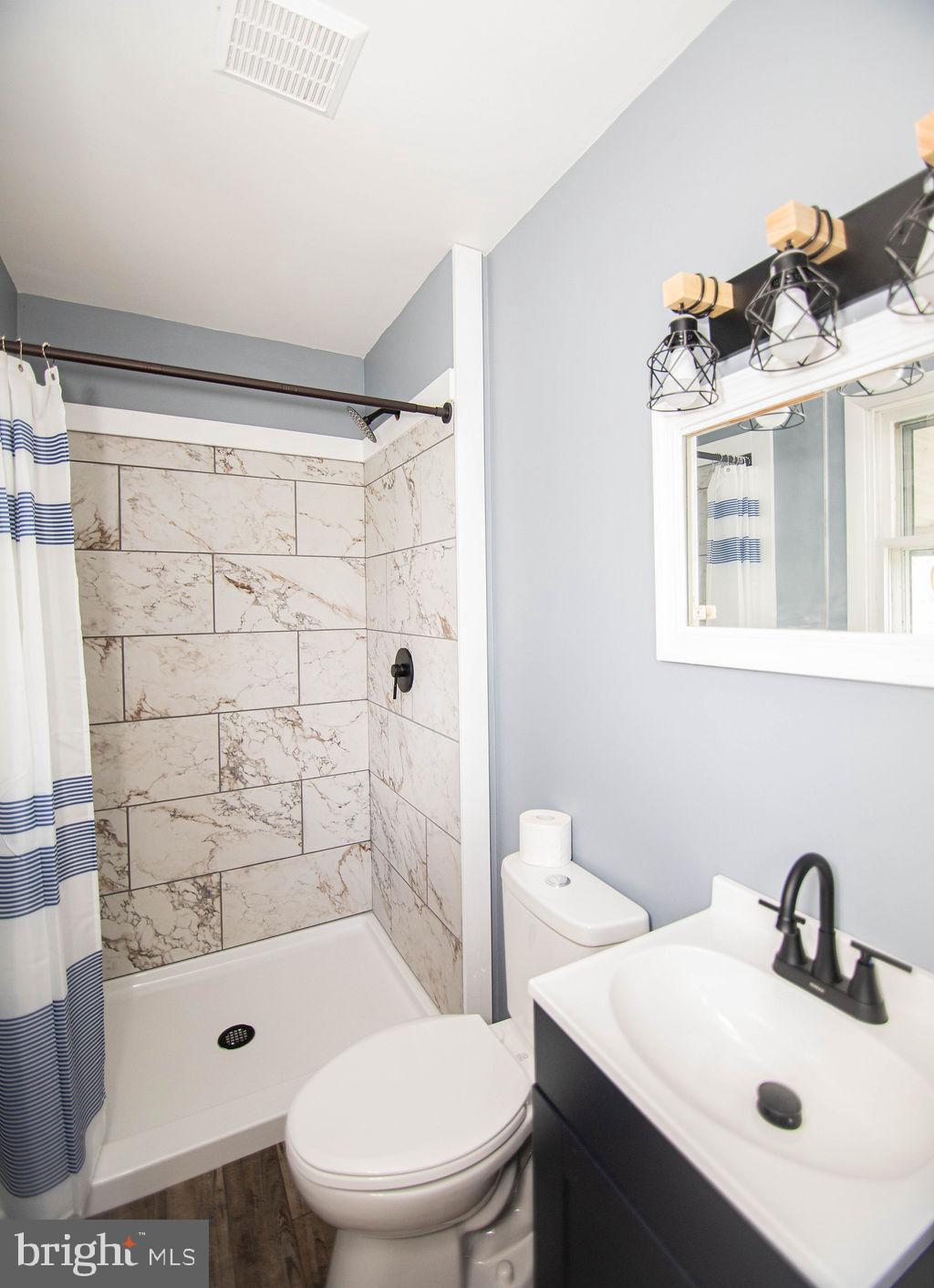 245 Windy Hill Road Shermans Dale, PA 17090 - Photo 30 of 42 a bathroom with a sink toilet and shower