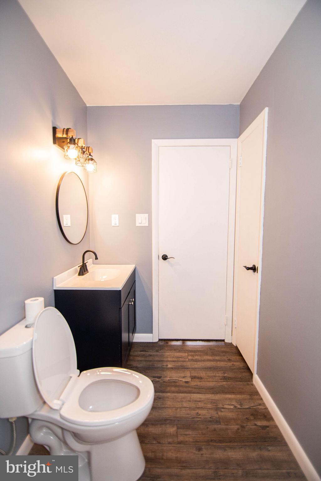 245 Windy Hill Road Shermans Dale, PA 17090 - Photo 35 of 42 a bathroom with a toilet a sink and mirror
