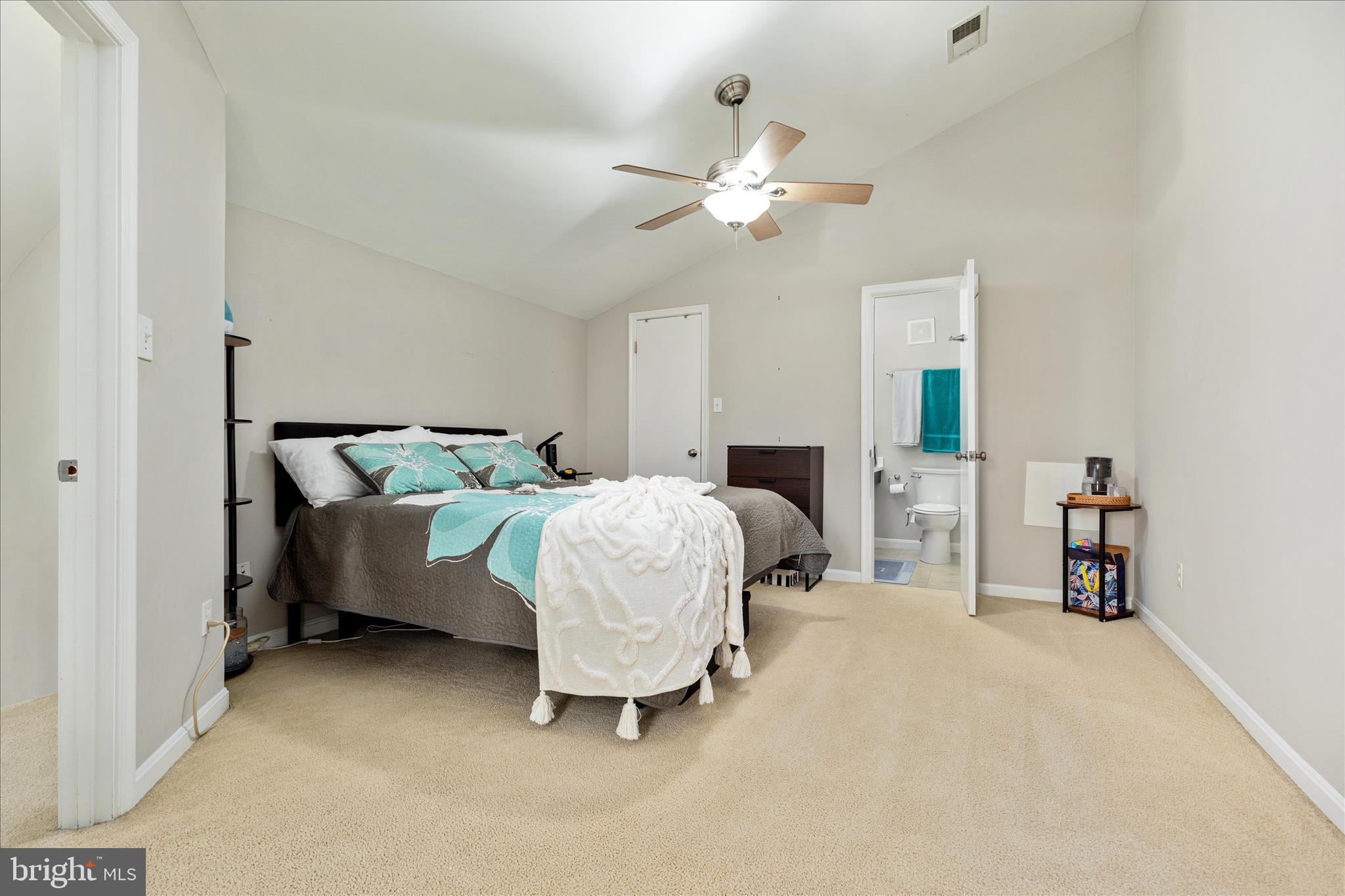 10198 Oakton Terrace Road Oakton, VA 22124 - Photo 17 of 22 a bedroom with a bed and a chandelier