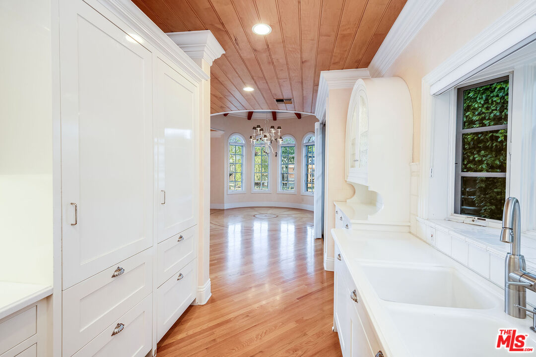 10045 Valley Spring Lane Toluca Lake, CA 91602 - Photo 13 of 36 a bathroom with a tub shower and sink