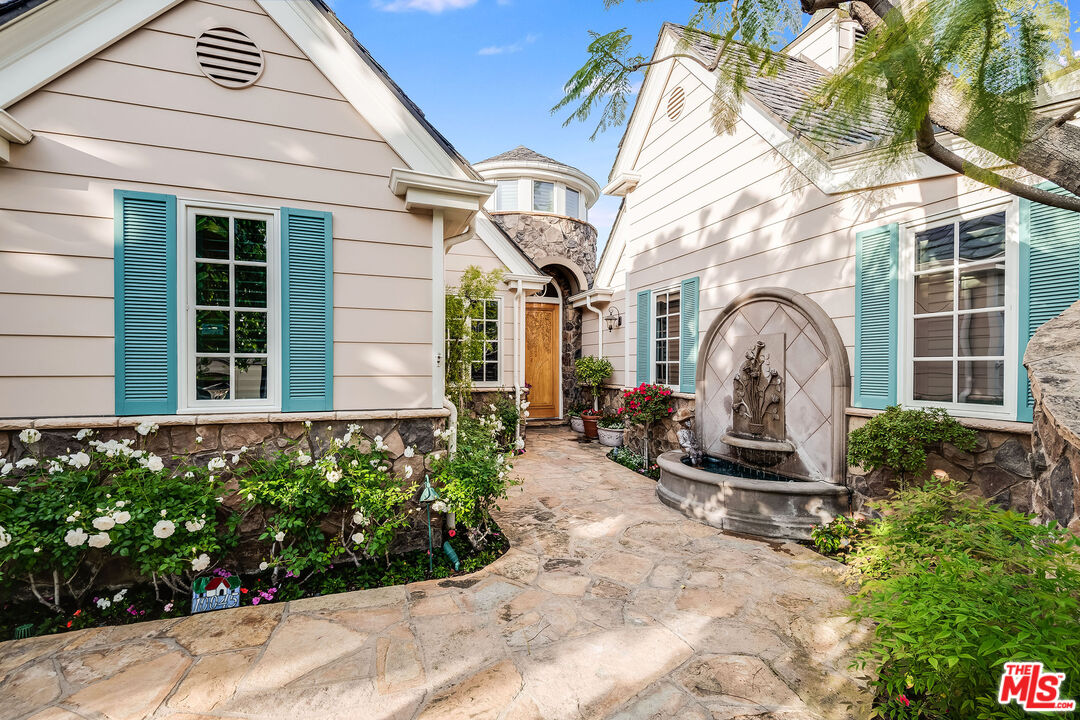 10045 Valley Spring Lane Toluca Lake, CA 91602 - Photo 2 of 36 a front view of a house