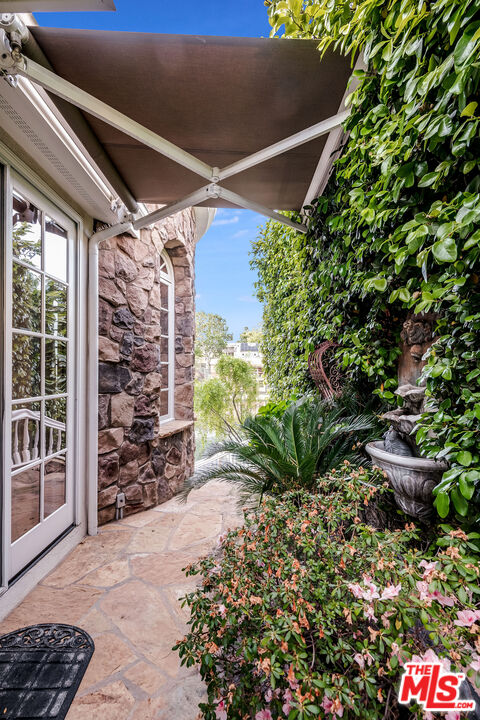 10045 Valley Spring Lane Toluca Lake, CA 91602 - Photo 28 of 36 a view of a back yard of the house