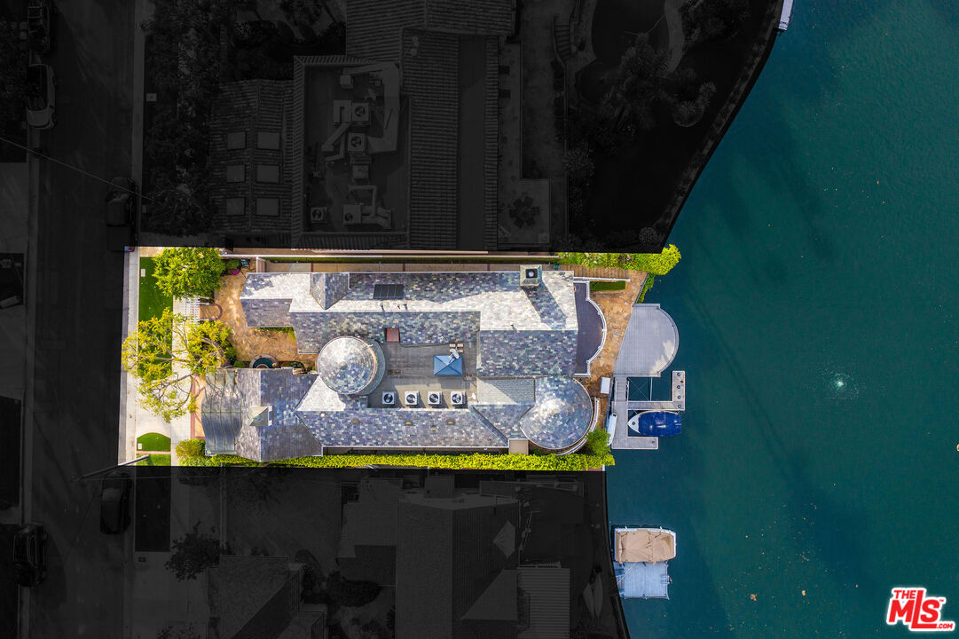 10045 Valley Spring Lane Toluca Lake, CA 91602 - Photo 34 of 36 a table with chairs and potted plant