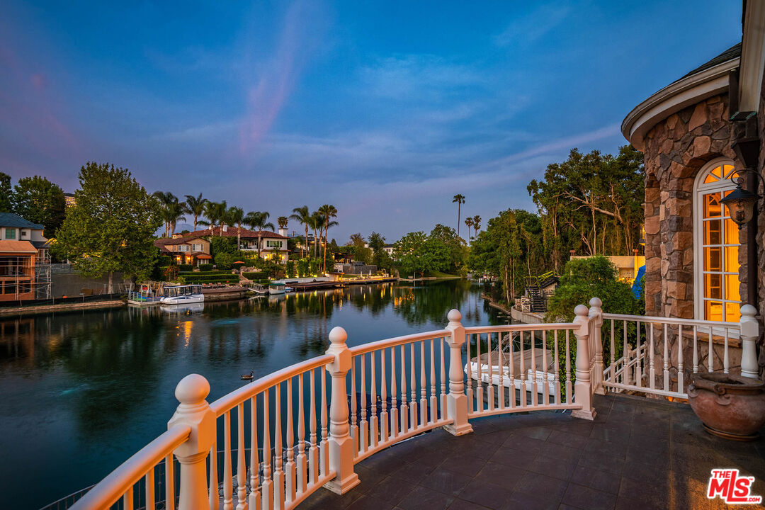 10045 Valley Spring Lane Toluca Lake, CA 91602 - Photo 4 of 36 a view of a lake with a city from a lake