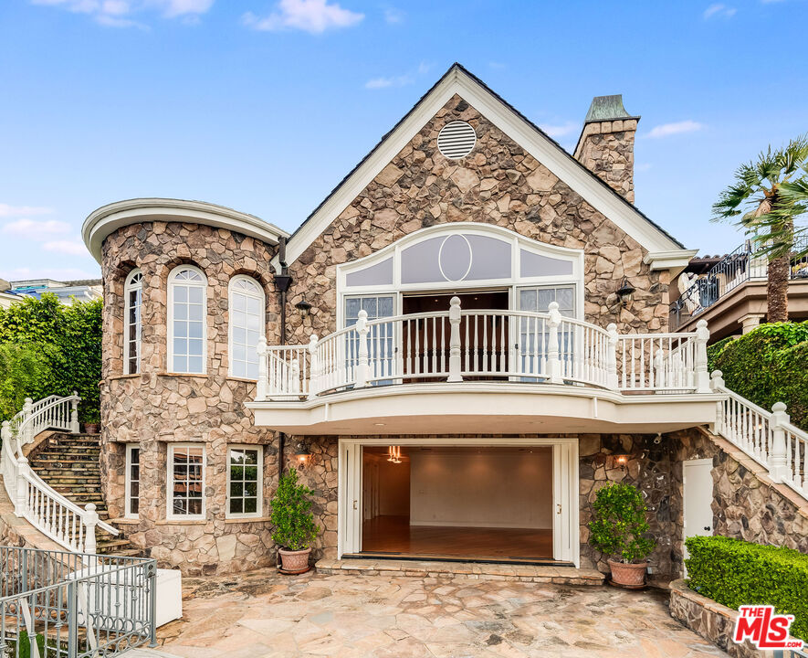 10045 Valley Spring Lane Toluca Lake, CA 91602 - Photo 5 of 36 front view of a house with a front door