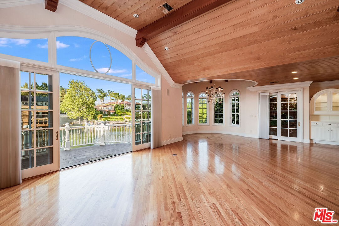 10045 Valley Spring Lane Toluca Lake, CA 91602 - Photo 9 of 36 a view of an entryway with wooden floor