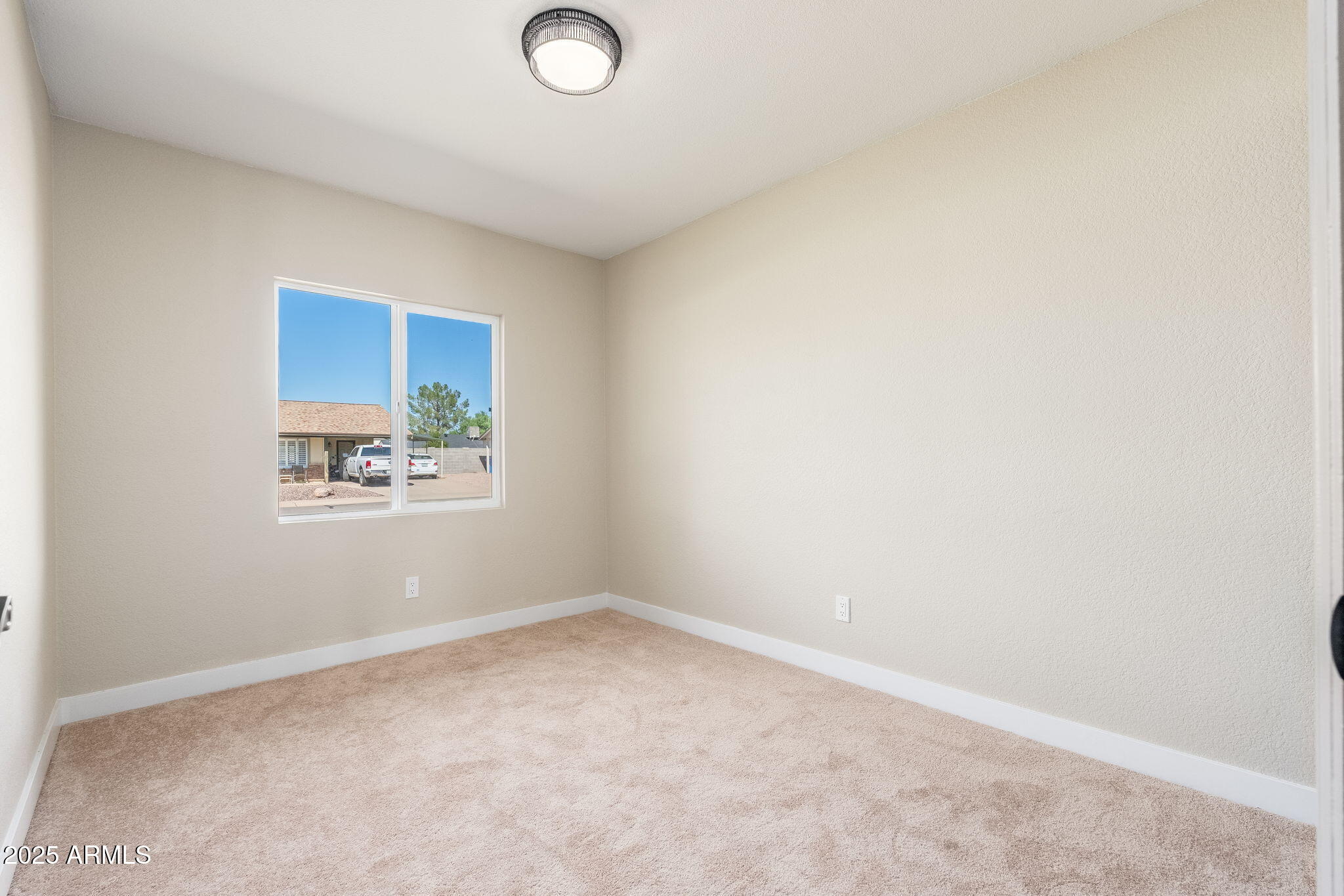 1805 West Cheyenne Drive Chandler, AZ 85224 - Photo 17 of 32 an empty room with a window