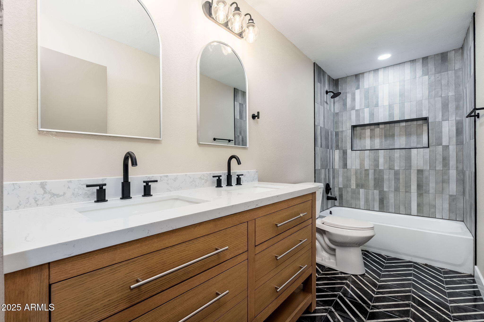 1805 West Cheyenne Drive Chandler, AZ 85224 - Photo 23 of 32 a bathroom with a sink toilet a mirror and shower
