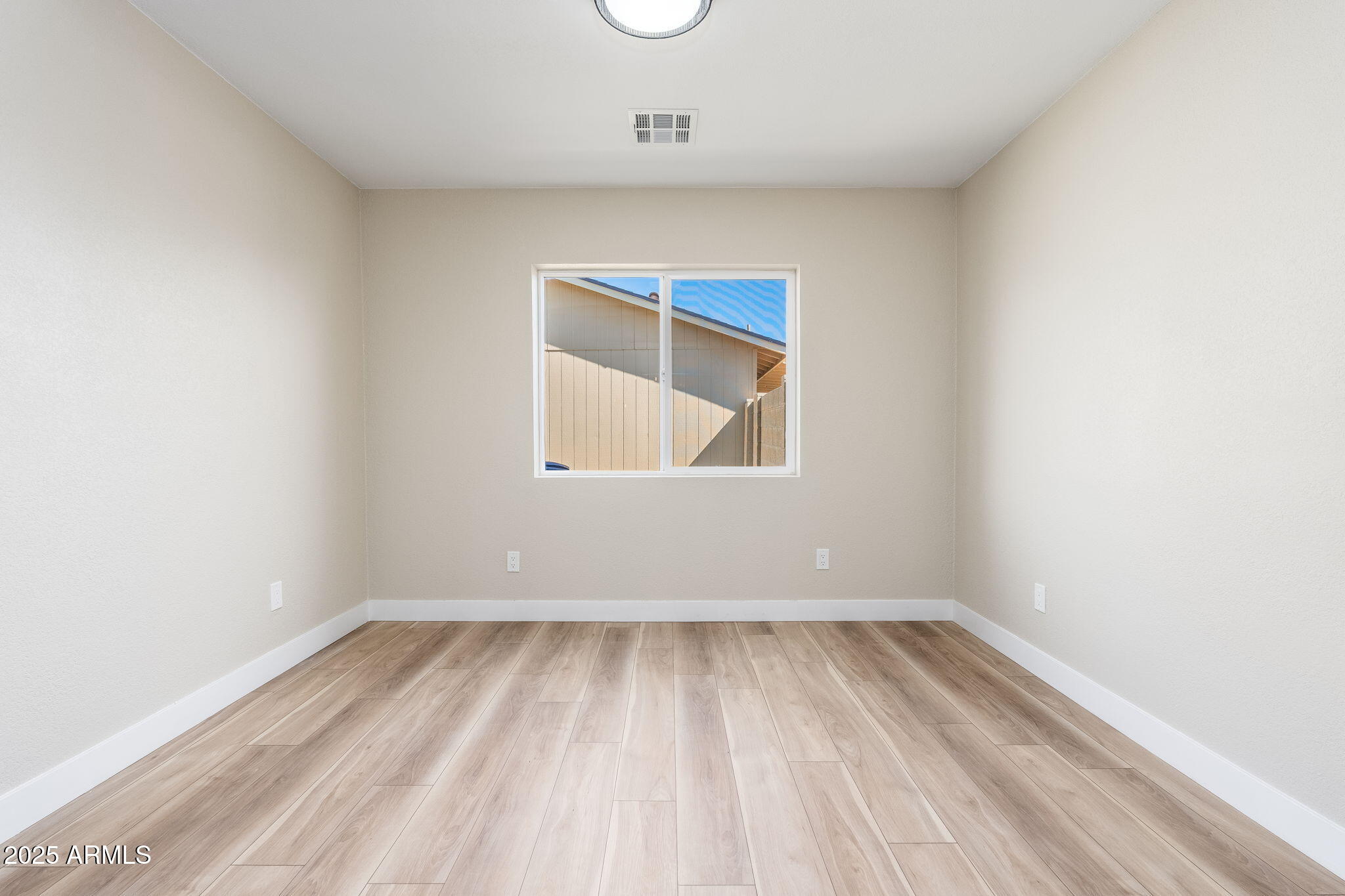 1805 West Cheyenne Drive Chandler, AZ 85224 - Photo 24 of 32 an empty room with a window