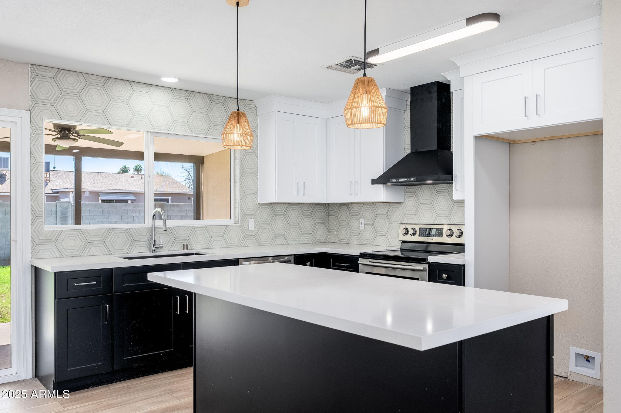 1805 West Cheyenne Drive Chandler, AZ 85224 - Photo 3 of 32 a kitchen with stainless steel appliances a sink a stove a refrigerator and cabinets