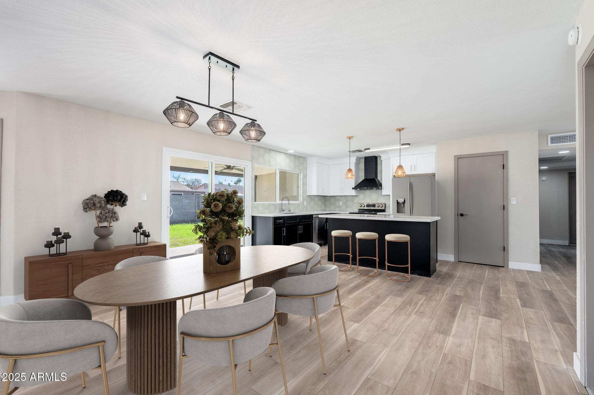 1805 West Cheyenne Drive Chandler, AZ 85224 - Photo 5 of 32 a kitchen with a dining table cabinets appliances and a counter top space
