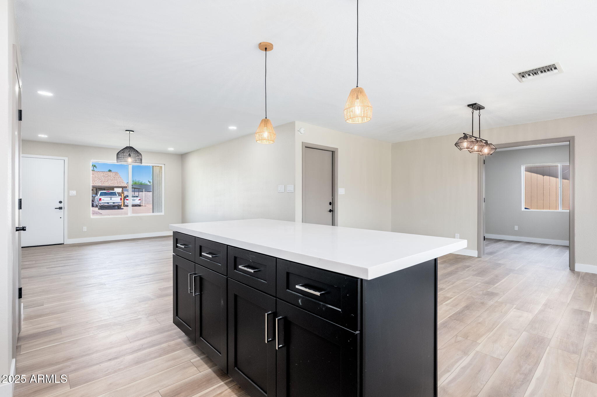 1805 West Cheyenne Drive Chandler, AZ 85224 - Photo 6 of 32 a view of a kitchen with a sink a chandelier stainless steel appliances and cabinets