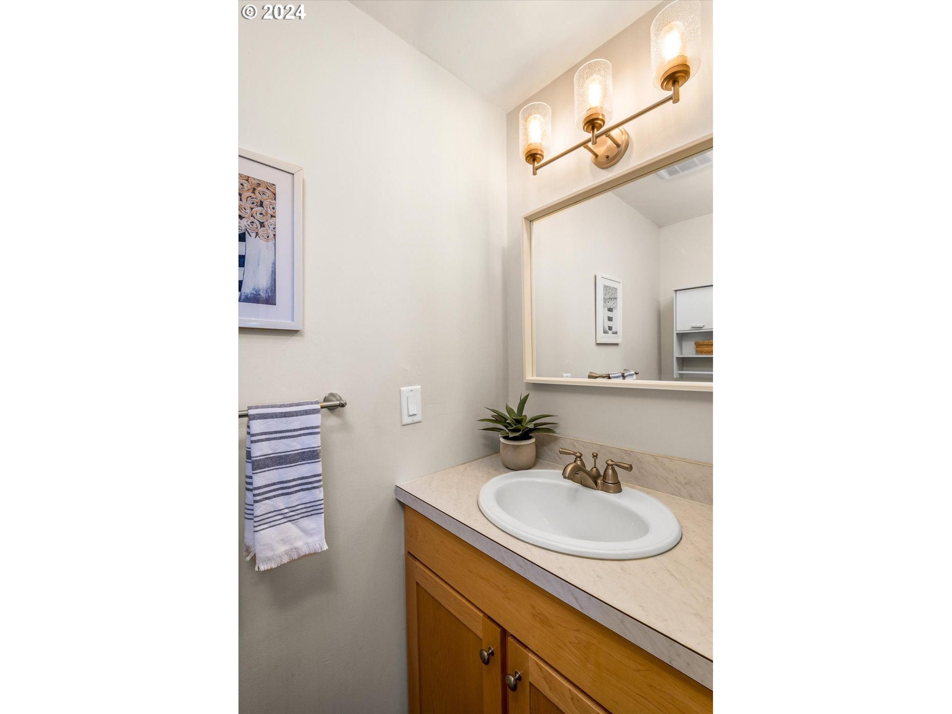 2602 Agate Street Eugene, OR 97403 - Photo 17 of 37 a bathroom with a sink and a mirror